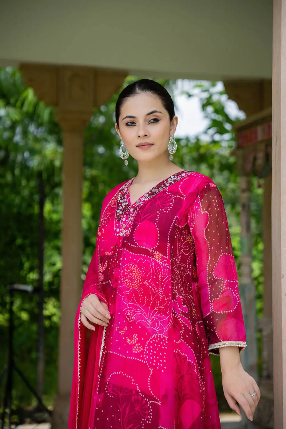 elegant red a line kurta set with embroidered v neck and abstract floral print