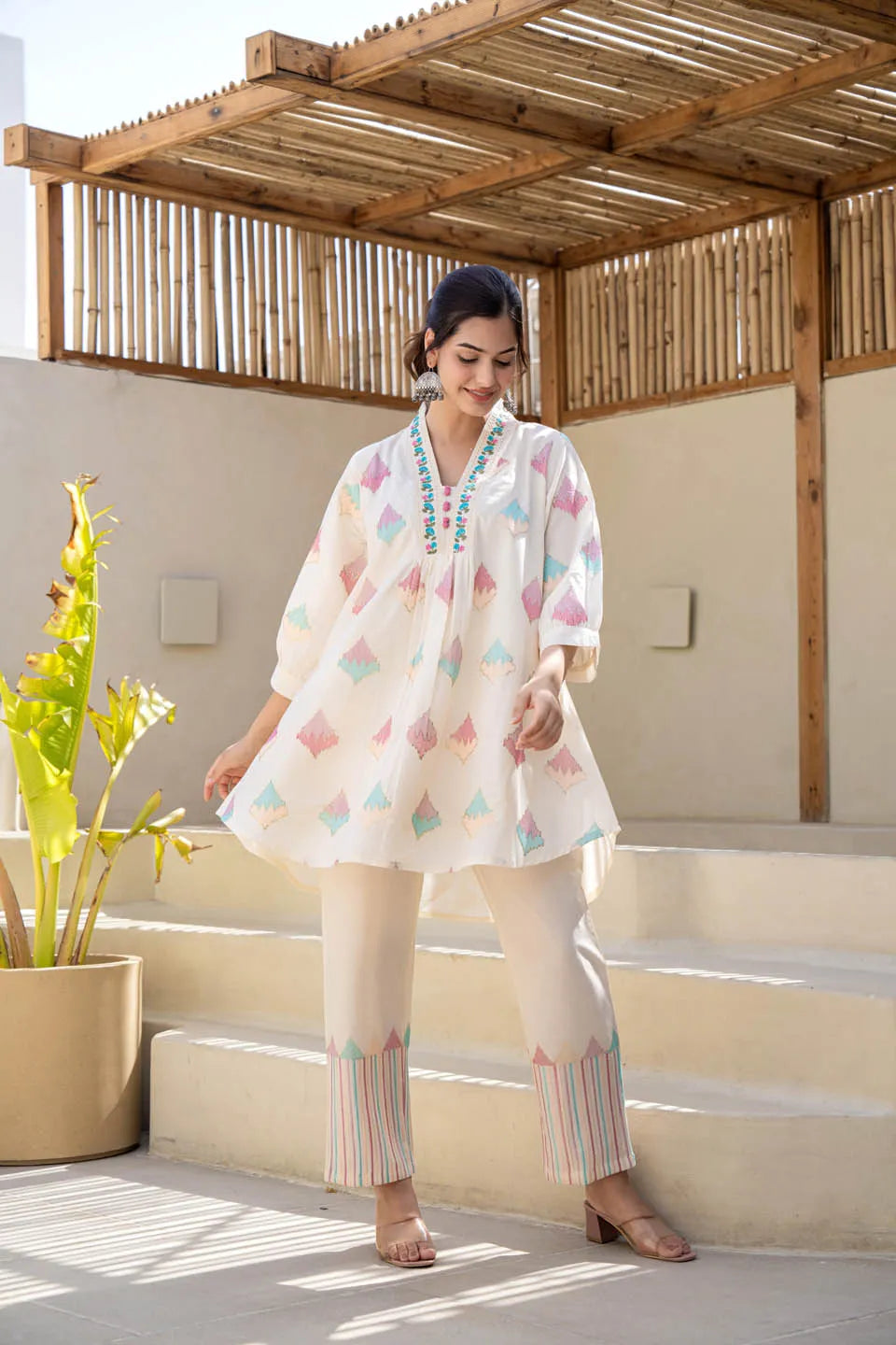 Off-white pastel geometric printed A-line kurta set with embroidered detailing & dupatta