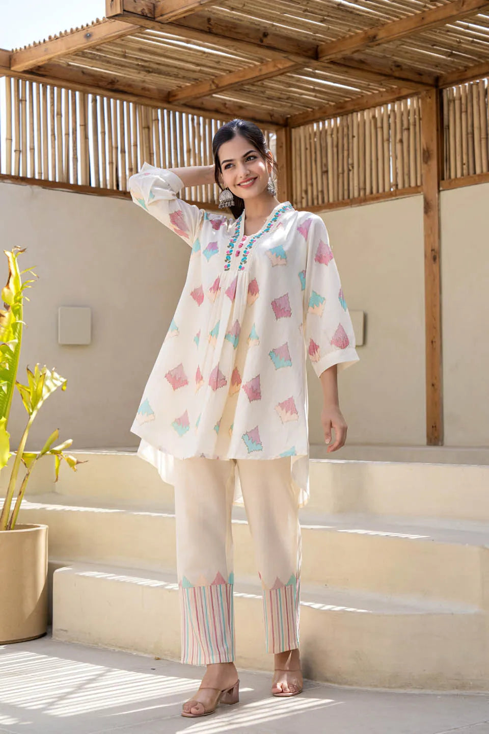 Off-white pastel geometric printed A-line kurta set with embroidered detailing & dupatta