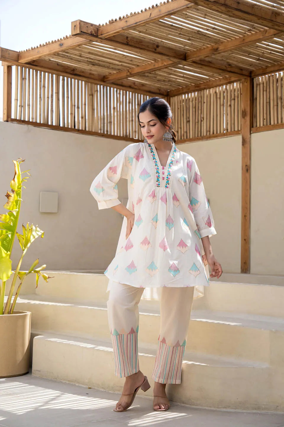 Off-white pastel geometric printed A-line kurta set with embroidered detailing & dupatta