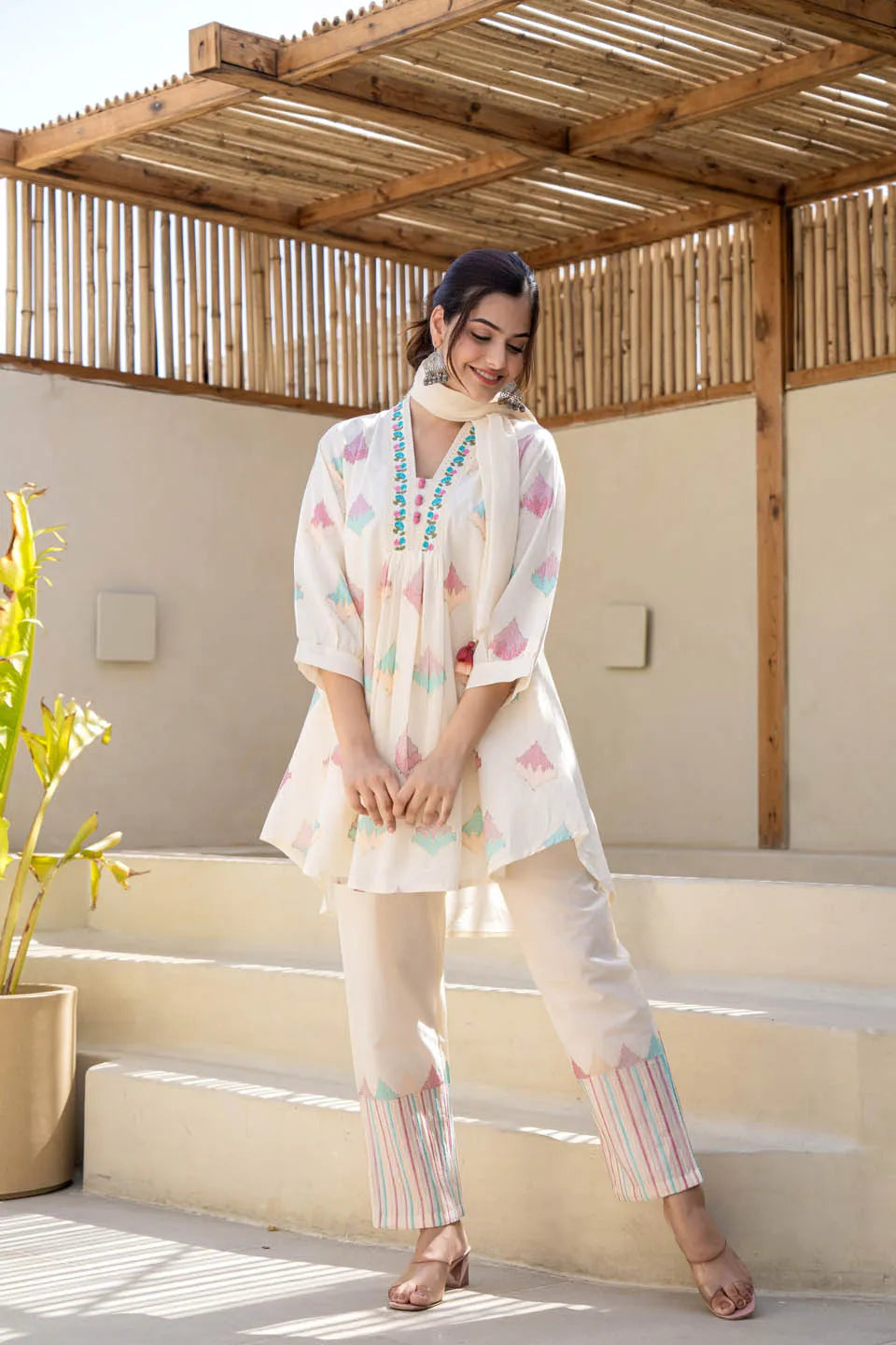 Off-white pastel geometric printed A-line kurta set with embroidered detailing & dupatta